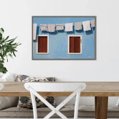 Amanti Art Hanging Laundry Along Blue Wall Framed Canvas by Brenda Tharp 12 Amanti Art Hanging Laundry Along Blue Wall Framed Canvas by Brenda Tharp -Amanti Art Shop GUEST 21ee6bf8 104c 4610 a236 ef29e16bab9c
